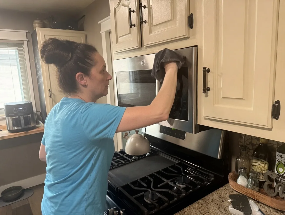 Kellie Erwin detailing a kitchen during a deep house-cleaning visit